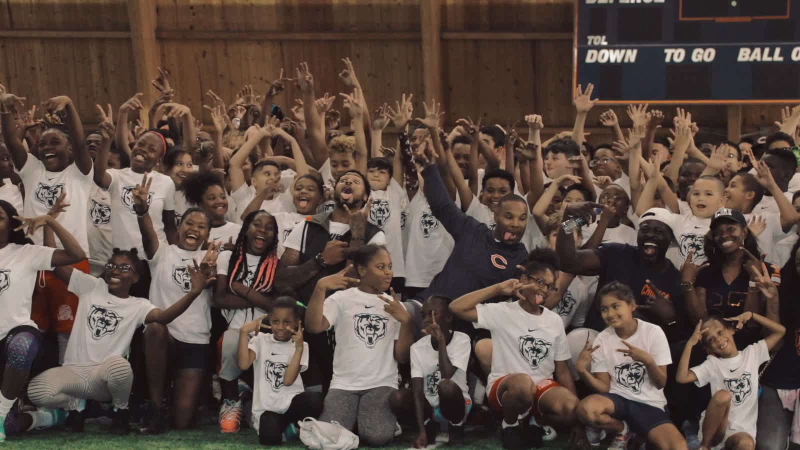 Kyle Prater with a camp full of young athletes at Nike's Sport Changes Everything